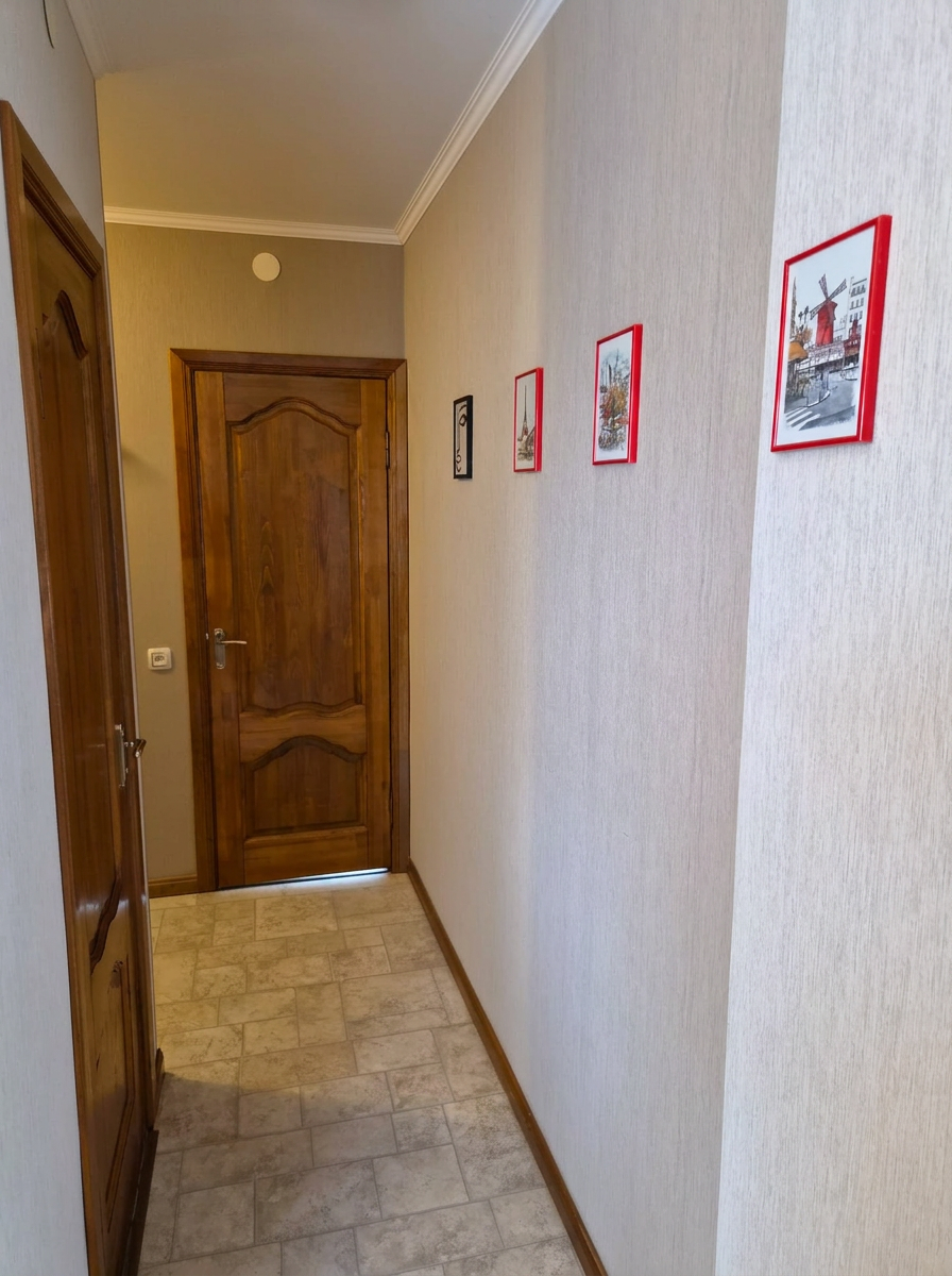 Hallway with framed pictures
